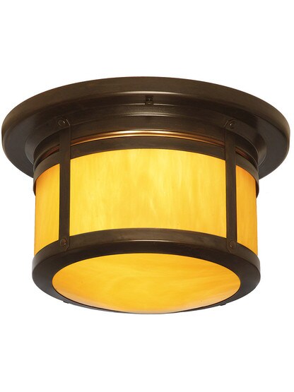Berkely Family Flush Mount Ceiling Fixture in Bronze Finish with Tan Glass.